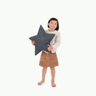 Nightfall (on sale)@Kid holding the nightfall star pillow