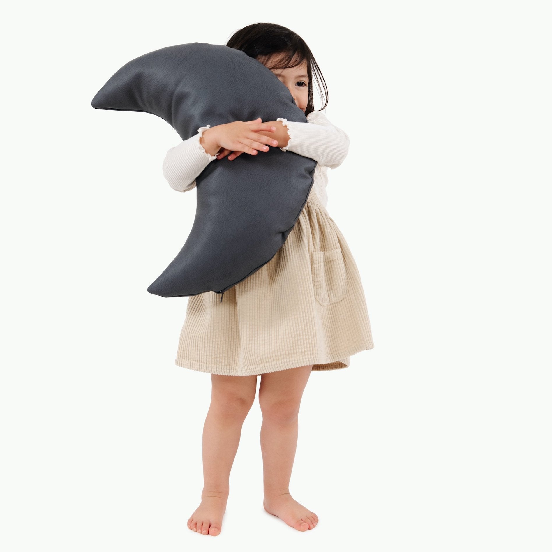 Nightfall (on sale)@kid holding a nightfall moon pillow