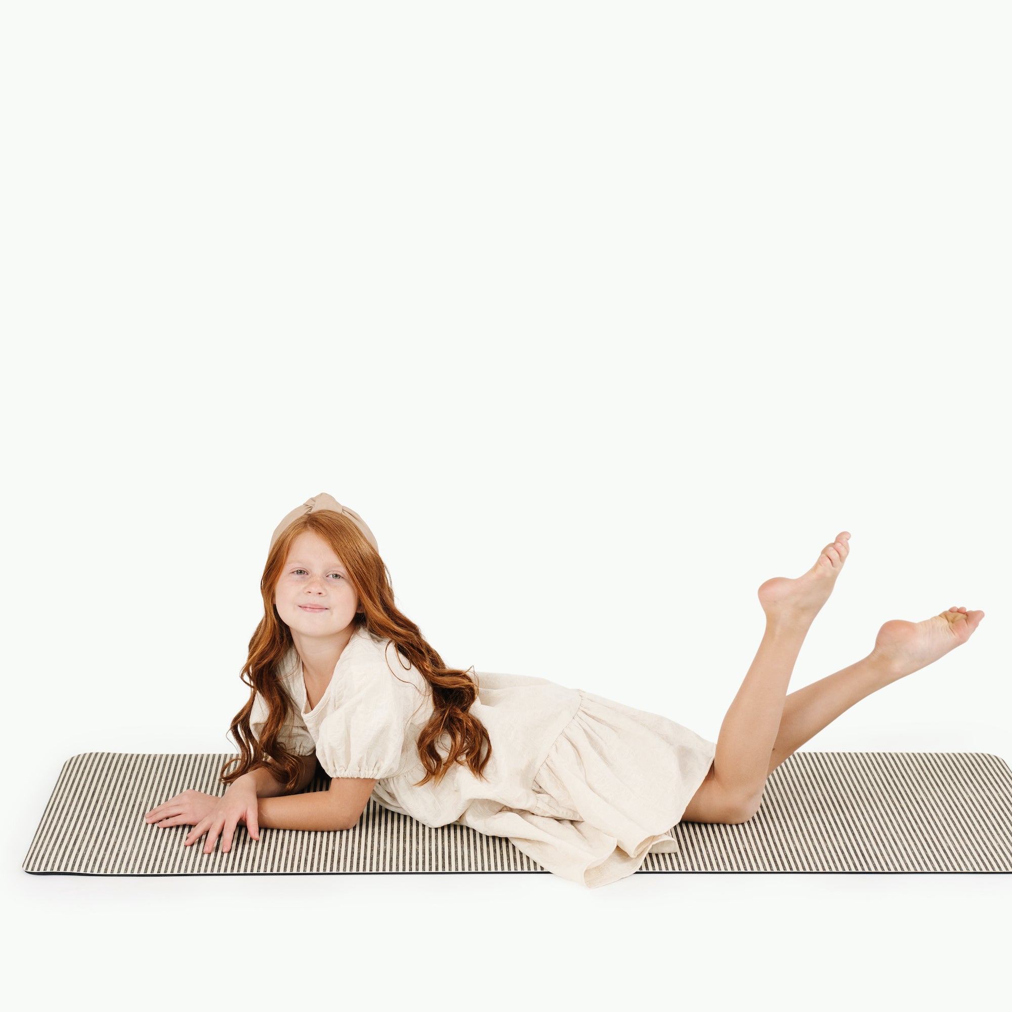 Stone Stripe (on sale)@kid laying on the stone stripe medium home mat